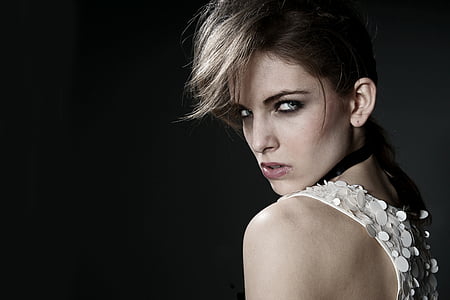 photo of woman wearing white sleeveless top] thumbnail
