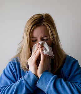 woman covering her nose with white towel thumbnail