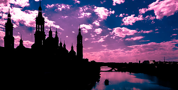 silhouette of castle during golden hour thumbnail