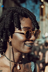 person wearing sunglasses in shallow focus photography thumbnail