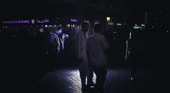 two men standing on pavement thumbnail