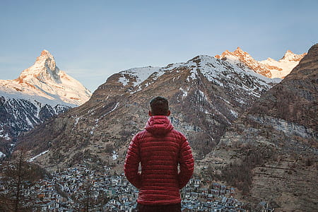 man standing in front of mountain thumbnail