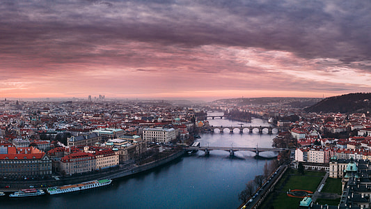 Beautiful Cityscape with a river under dusk skies in Prague, Czech Republic thumbnail