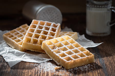 four waffle on white textile near mug thumbnail
