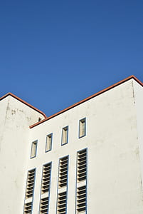 white and brown concrete building under blue sky at daytime thumbnail