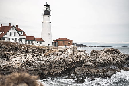 lighthouse under gray sky thumbnail