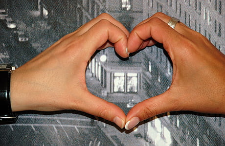 person hand creating heart formation thumbnail