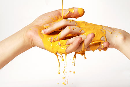 two person hands soaked in yellow liquid thumbnail