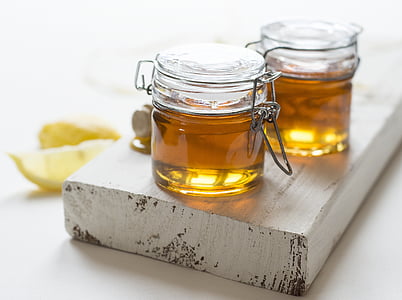 two clear airtight jars with oil thumbnail