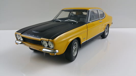 yellow and black coupe die-cast model displayed on tabletop thumbnail