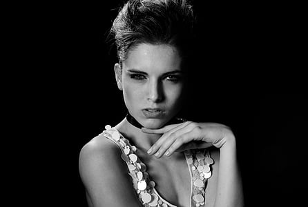 grayscale photo of woman wearing white spaghetti strap top thumbnail