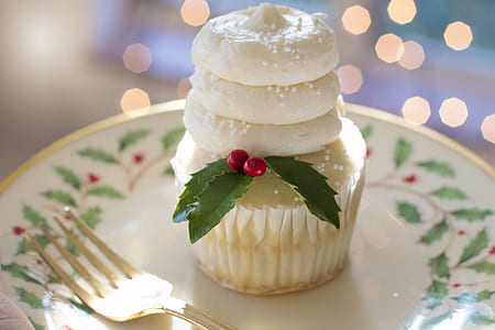 cupcake on round white and green floral ceramic saucer thumbnail
