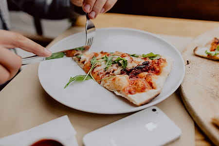 Eating delicious pizza in a cozy restaurant thumbnail
