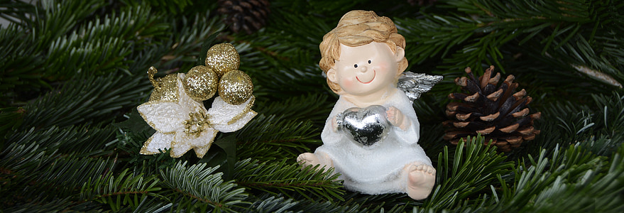 focused photo of angel ceramic figurine thumbnail