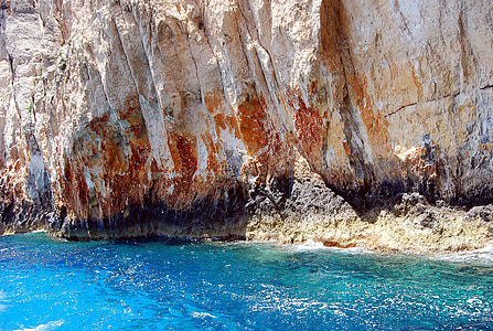 brown rock cliff beside the sea thumbnail