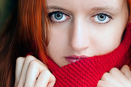 woman with red hair wearing red knitted scarf thumbnail