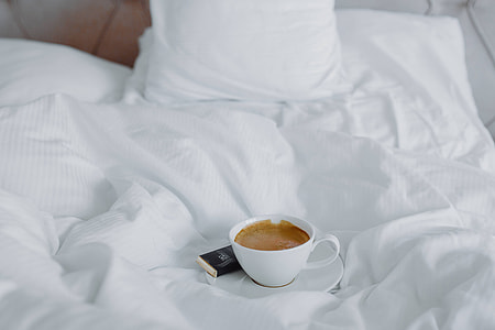 Morning coffee with chocolate in bed thumbnail