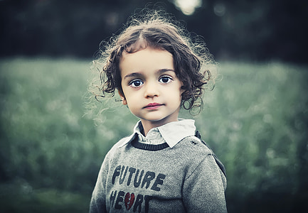 black haired child in gray sweater thumbnail