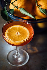 orange cocktail on table thumbnail
