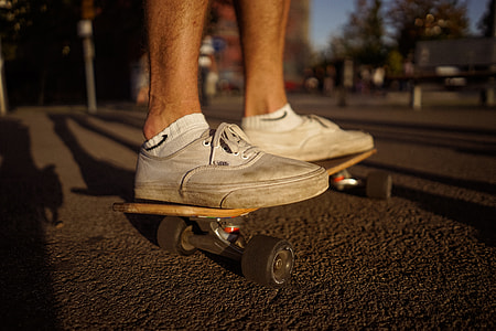 person wearing white Vans Authentic riding skateboard thumbnail