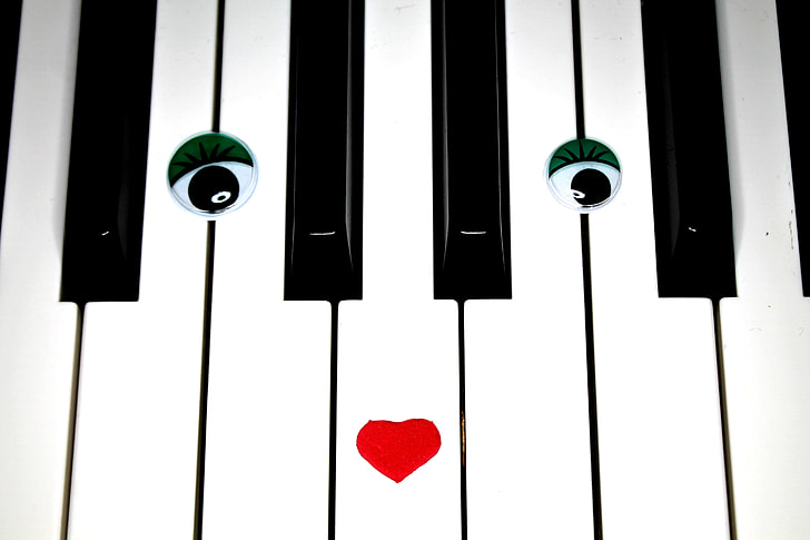eyes and heart on white and black keyboard