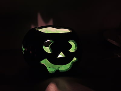green Jack'O Lantern decor against black background thumbnail