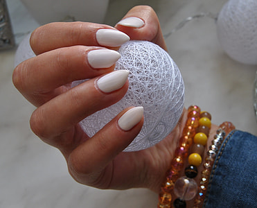 person holding white wire ball thumbnail