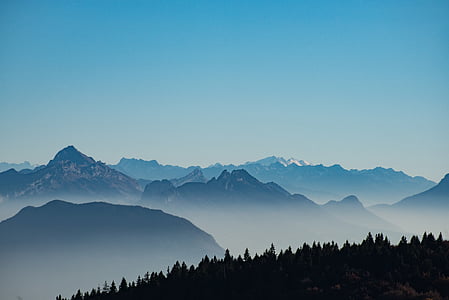 mountains covered with fogs at daytime thumbnail