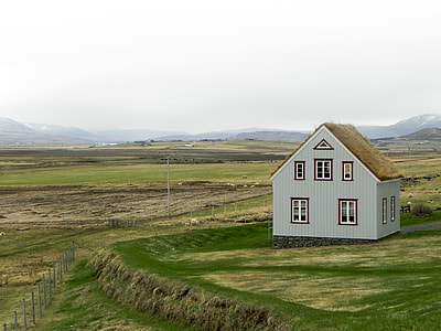 gray house near green leaf grass photo thumbnail