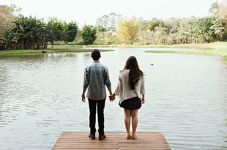 man and woman standing on dock thumbnail