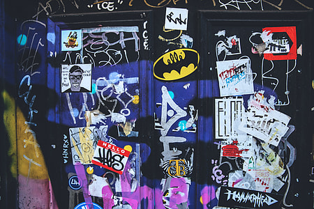Stickers, flyers and graffiti captured on a wall in East London thumbnail