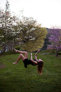 photo of floating woman near trees thumbnail