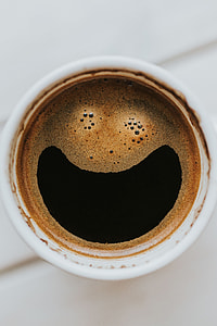 Coffee on a table with other items thumbnail