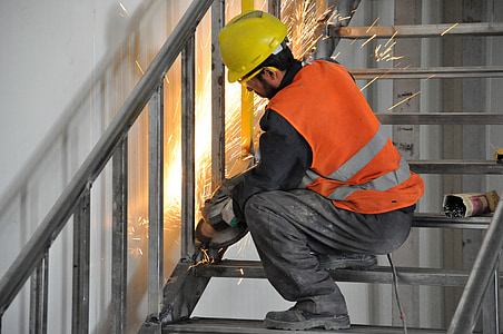 man using angle grinder on stair thumbnail