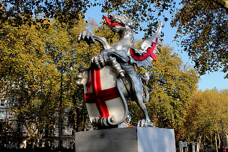 gray and red animal statue thumbnail