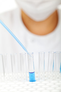 clear glass test tubes with blue liquid thumbnail