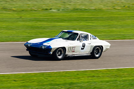 white coupe in road during daytime thumbnail