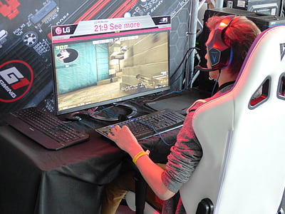 man sitting while playing online games thumbnail