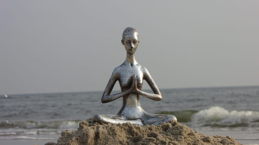 female statue near seashore thumbnail