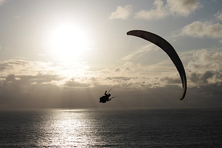 photo of person paragliding during daytime thumbnail