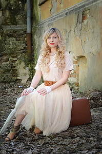 woman wearing beige maxi dress thumbnail