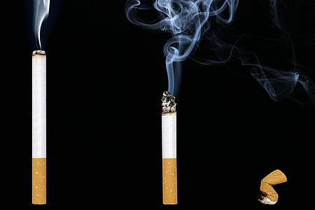 three lighted cigarette sticks thumbnail