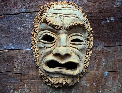 mask on wood planks thumbnail