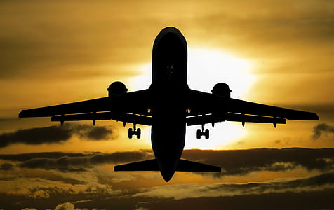 silhouette photography of airplane during golden hour thumbnail