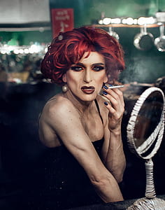 photo of person holding cigarette stick thumbnail