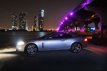 silver coupe under bridge thumbnail