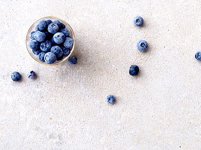 bowl of blueberries on beige surface thumbnail