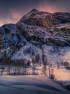 mountain covered in snow during day time thumbnail
