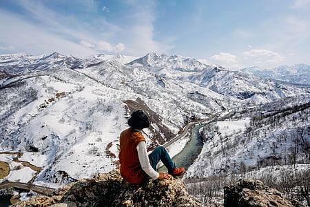 woman sitting on top of cliff thumbnail