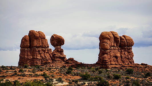 three canyons on desert during daytime thumbnail
